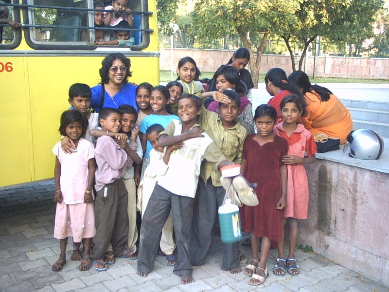 Children beside the school bus in October 2005